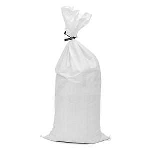 White polypropylene sandbags stacked on a pallet